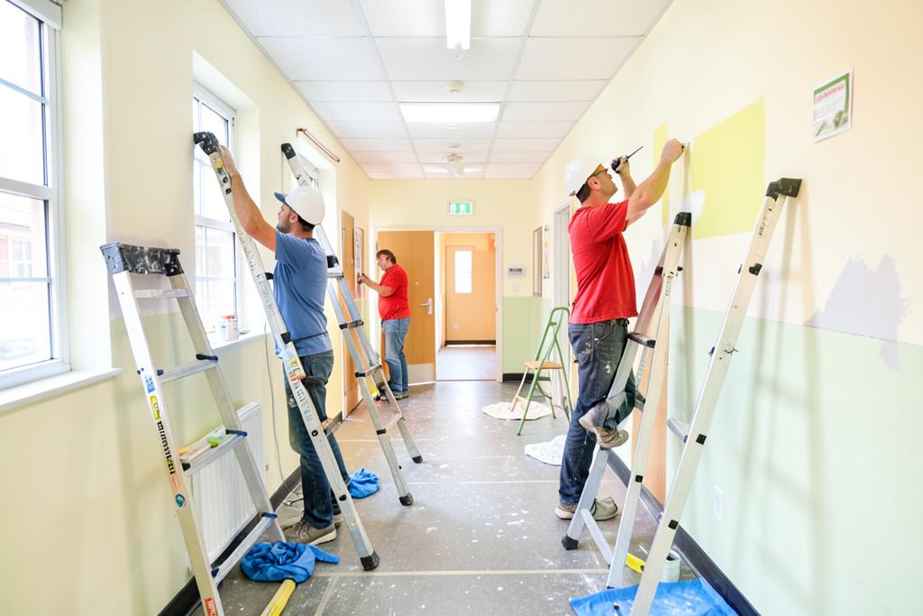 Crew repainting a school hallway and classrooms in metro Atlanta