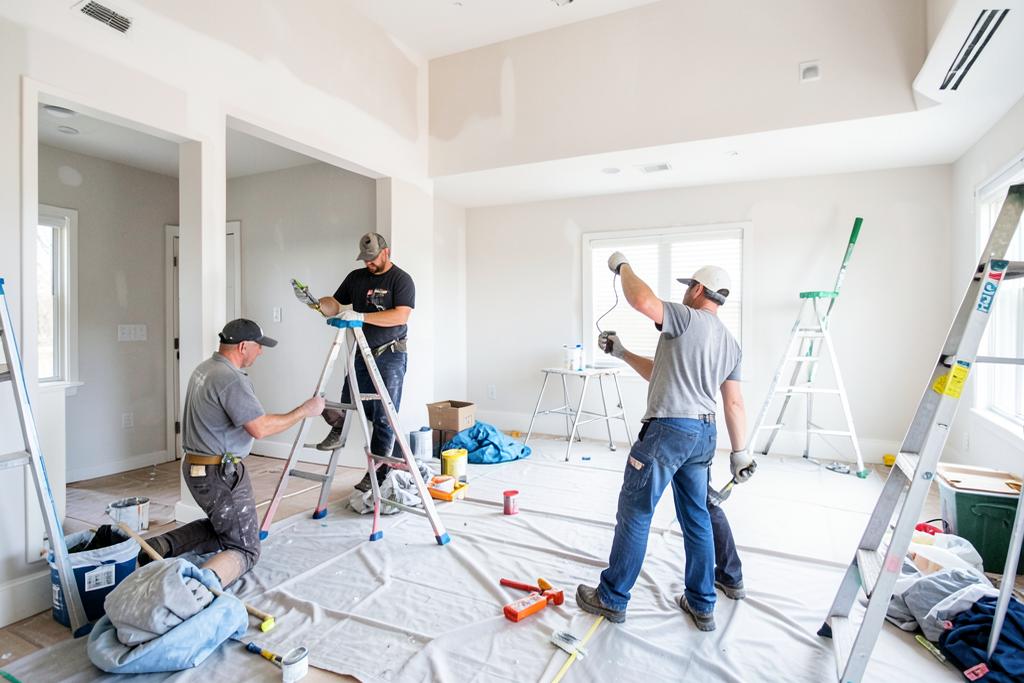 Crew repainting several rooms during a whole-home interior painting project in Atlanta, GA